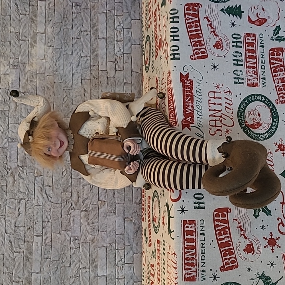 Artic Holiday 24" Sitting Christmas Elf Holding a Christmas Present